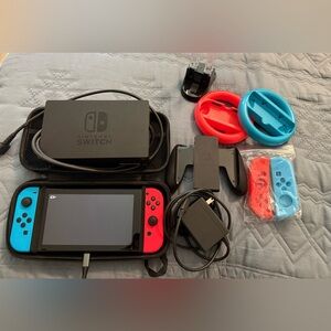 Nintendo Switch with Red and Blue Joy-Con Controllers